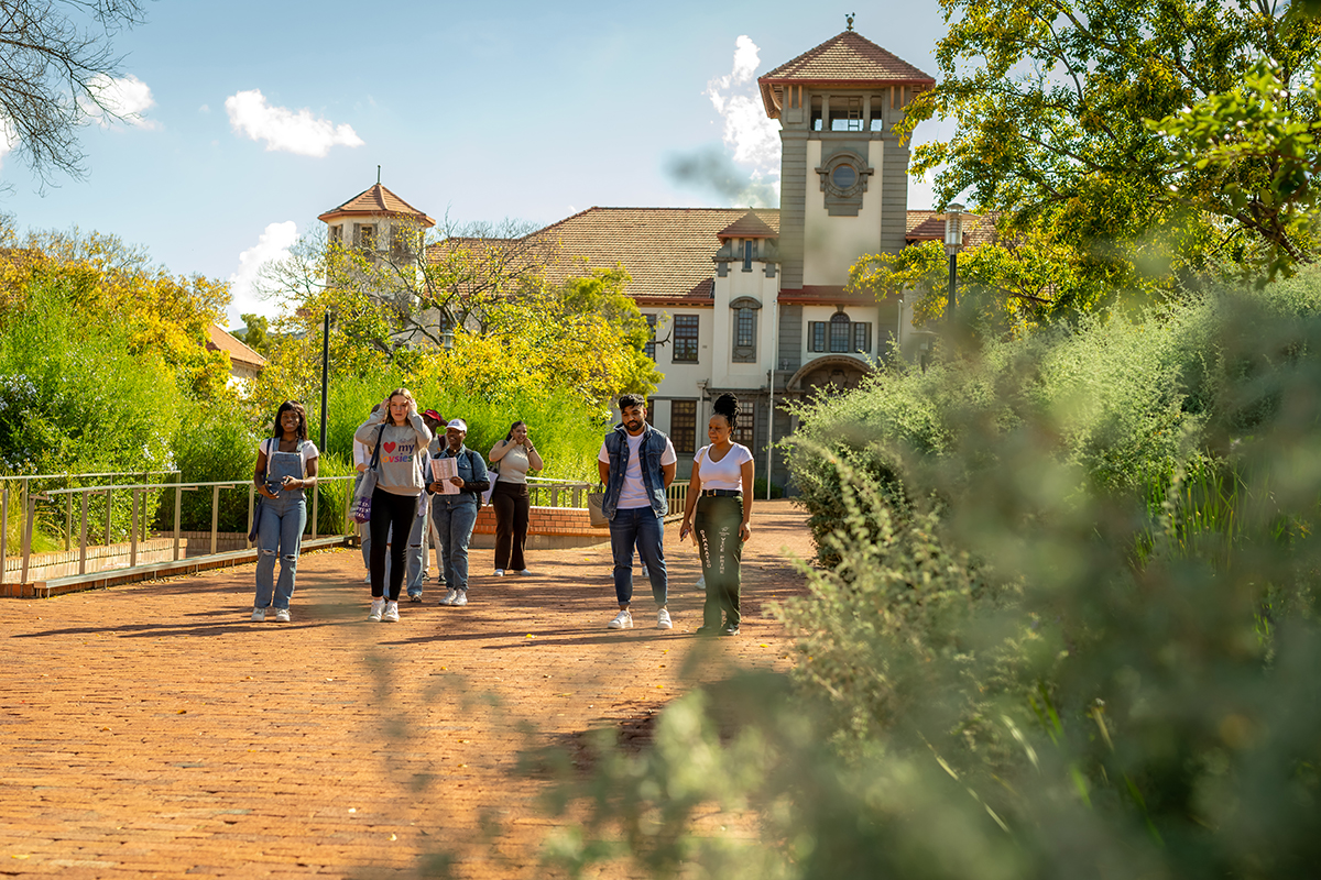 Group of students walking from the Main Building