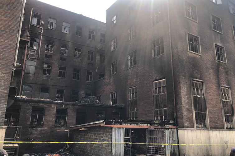 The aftermath of damage to a building in Johannesburg, after burning.