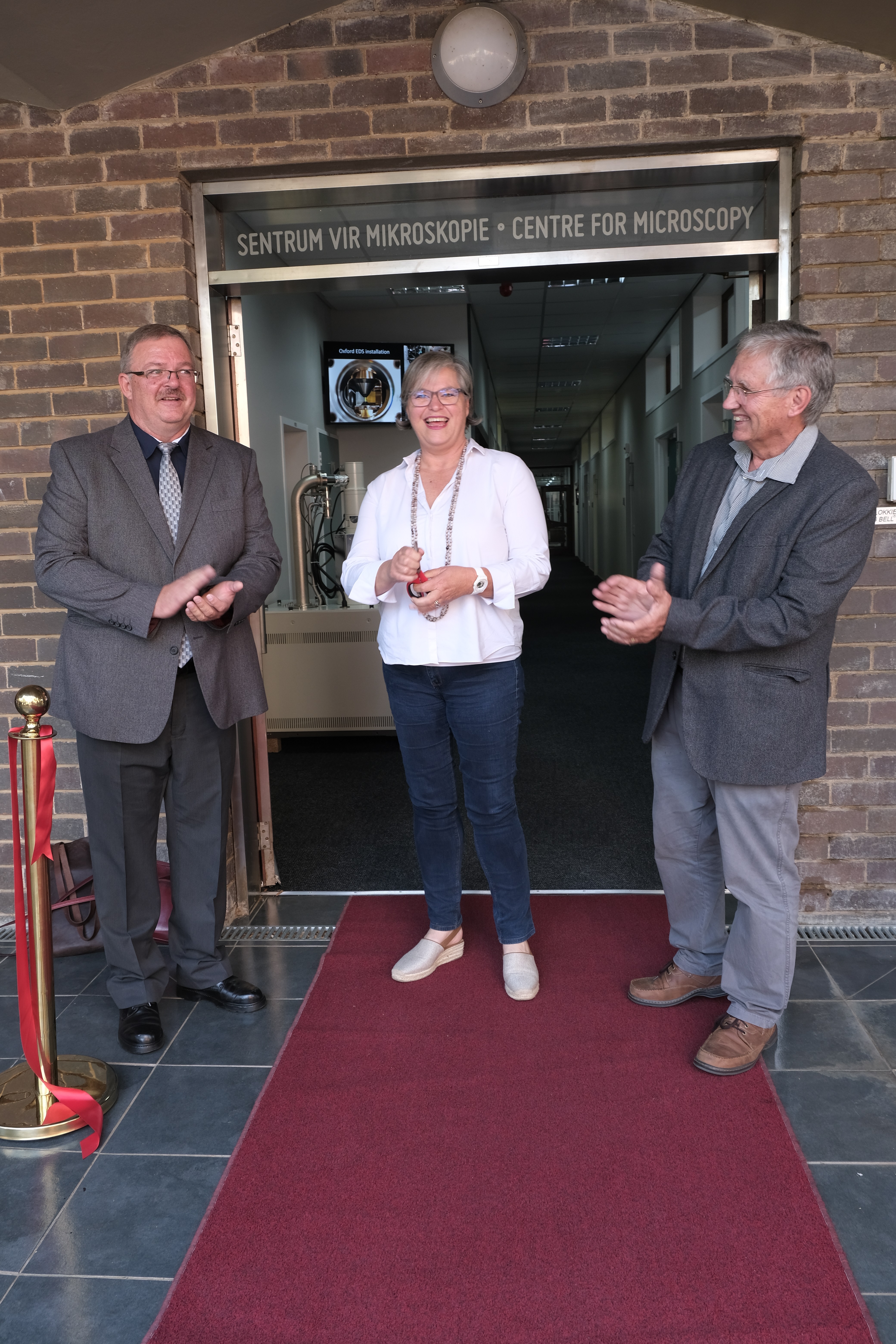 Ribbon cutting: Prof Corli Witthuhn together with Prof Koos Terblans,left, and Prof Danie Vermeulen