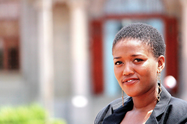 A head and sholder photograph of Nombulelo Shange in front of the UFS Main Building.