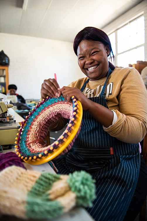 Woman knitting for UFS wool project