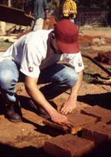 Description: A man building with earthen bricks.  Tags: department of architecture, architecture, UEC, unit for earth construction, earth construction, construction