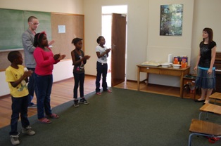 Description: Marnus Nieuwoudt, B.Mus. student, with learners from the Odeion School of Music Tags: Marnus Nieuwoudt, B.Mus., Mangaung String Programme, service learning, Odeion School of Music